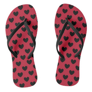 Black polka hearts on red flip flops