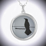 Black Raven Silhouette Customizable Silver Plated Necklace<br><div class="desc">This dramatic grey and black pendant necklace features the silhouette of a solitary Raven perched on a wire against a grey sky. It quotes The Raven Nevermore, but can be personalized with a Name. Throughout history and world cultures, the raven is found in lore, mythology and literature. The raven's symbolism...</div>