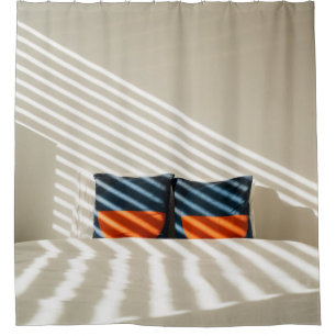 Black red and white plaid textile on white bed