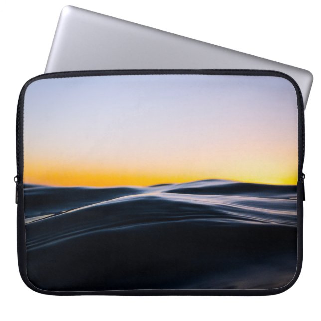BLACK SAND UNDER ORANGE SKY DURING SUNSET LAPTOP SLEEVE (Front)