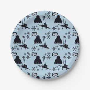 Black ski equipment & snowflakes on blue paper plate