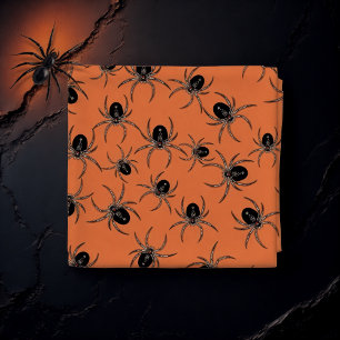 Black spiders on orange fabric