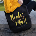 Black Stripes Faux Gold Brush Script Bridesmaid Tote Bag<br><div class="desc">Personalized Bridesmaid tote bag featuring the word "Bridesmaid" in faux gold trendy brush script against a black stripes background that's perfect for your bridesmaid to carry her items. Check out the matching makeup bag here https://www.zazzle.com/black_stripes_faux_gold_brush_script_bridesmaid_cosmetic_bag-223876160979955152 Personalize it by replacing the placeholder text. For more options such as to change the...</div>