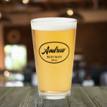 Black Stylized Name Wedding Best Man Glass<br><div class="desc">Beer glass for the wedding Best Man that features his name printed in black,  stylized script inside a black bordered oval along with wedding year date. Personalize your beer glass by editing and replacing name and date with your own.</div>