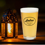 Black Stylized Wedding Best Man Name Glass<br><div class="desc">Beer glass for the wedding Best Man that features his name printed in black, stylized script inside a black bordered oval along with wedding date. A great party supply idea for a bachelor party! Personalize your beer glass by editing and replacing name and date with your own. Available in many,...</div>
