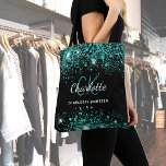 Black teal green glitter monogram tote bag<br><div class="desc">A stylish black coloured background. Decorated with teal,  green faux glitter dust. Personalize and add your first name,  monogram initials and full name. The name is written with a hand lettered style script.</div>