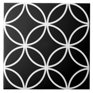 Black tile, white repeating circle leaf pattern tile