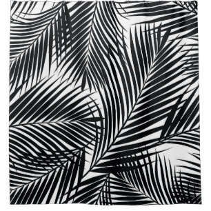 Black tropical palm leaves, white background