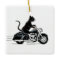 Black tuxedo cat riding a motorcycle
