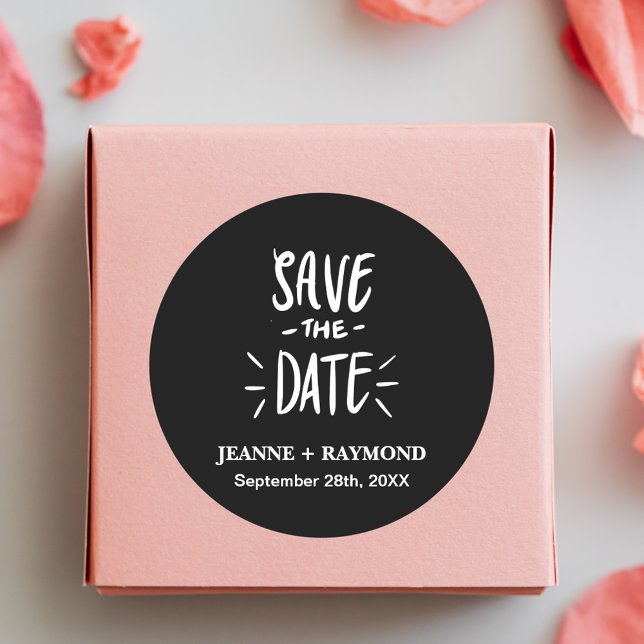 Black Typography Customized Wedding Save the Date Classic Round Sticker (Black typography save the date sticker adds elegant personalized charm to wedding announcements.)