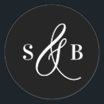 Black Whimsical Calligraphy Wedding Monogram Classic Round Sticker<br><div class="desc">Add a charming finishing touch to your wedding stationery or favours with this wedding sticker featuring a whimsical calligraphy ampersand. Designed with a romantic yet modern flair, this sticker is perfect for sealing envelopes, decorating favour boxes, or adding a personalized detail to welcome bags and more. The hand-drawn ampersand adds...</div>