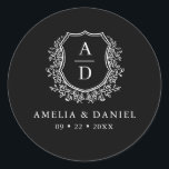 Black White Crest Modern Monogram Wedding  Classic Round Sticker<br><div class="desc">Add a timeless and elegant touch to your wedding with the Black White Crest Modern Monogram Wedding Classic Round Sticker. Featuring a sleek black background, a refined white crest design, and a personalized monogram, this sticker is perfect for enhancing your wedding invitations, favours, or stationery. Its minimalist yet sophisticated design...</div>