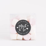 Black & White Mint to Be Wedding Favour Classic Round Sticker<br><div class="desc">Punny wedding favour stickers feature "mint to be" in white hand lettered script accented with hearts,  on a soft ash black background. Personalize with your names and wedding date.</div>