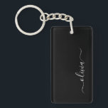 Black White Modern Minimalist Elegant Monogram Keychain<br><div class="desc">Introducing our Black and White Minimalist Modern Monogram Collection: Embrace simplicity and sophistication with our minimalist designs, curated to elevate your style effortlessly. Crafted with a keen eye for modern aesthetics, this collection features sleek black and white designs accentuated by personalized monograms. From chic stationery to versatile accessories, our collection...</div>