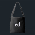 Black white monogram initials modern crossbody bag<br><div class="desc">A classic chic black background. Personalize and add your monogram initials written with white block letters. Modern,  trendy and simple.</div>