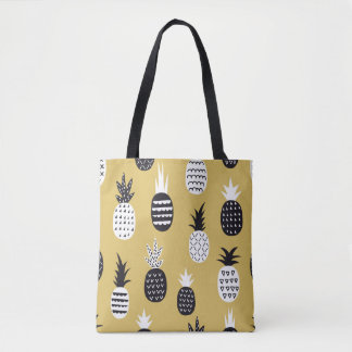 Black, white pineapples, yellow background tote bag