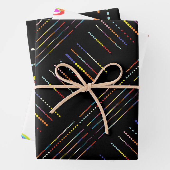 Black with multi coloured patterns wrapping paper sheet (In situ)