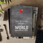 Blackboard teacher name red apple quote planner<br><div class="desc">White typography script quote "Your teacher changes the world one child at a time" on a dark grey charcoal chalkboard background and a small red apple.             Personalize this planner with your best teacher's name and make it a thoughtful keepsake gift to express your gratitude!</div>
