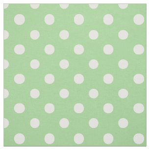 Blanc de soleil de ressort sur le tissu vert de