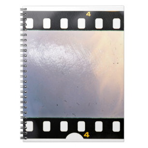 Blank 35mm film frame or strip on white background notebook