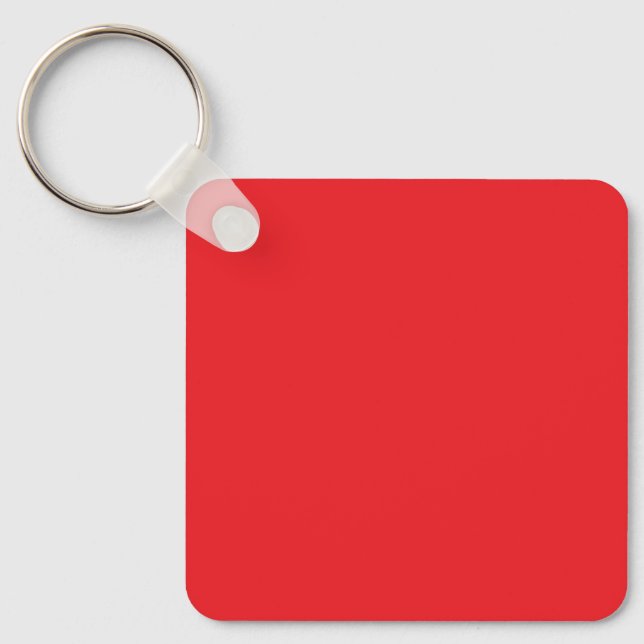Blank Red Square Keychain Tag on Wood Surface (Front)