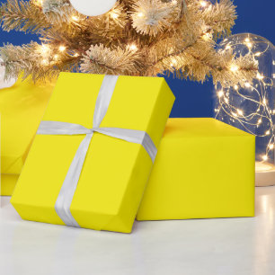blank yellow sheet, curled at one edge wrapping paper