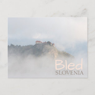 Bled castle surrounded by clouds postcard