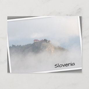 Bled castle surrounded by clouds postcard