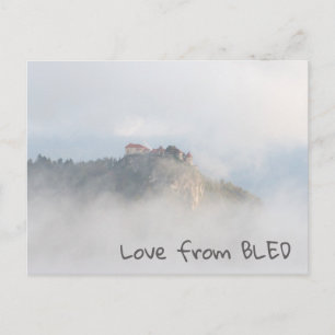 Bled castle surrounded by clouds postcard
