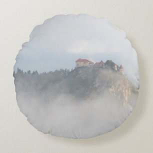 Bled castle surrounded by clouds round pillow