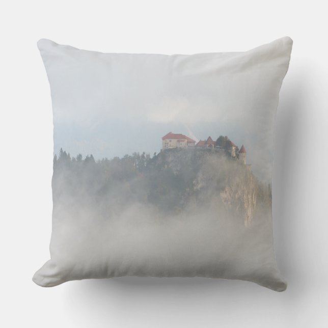 Bled castle surrounded by clouds throw pillow (Front)