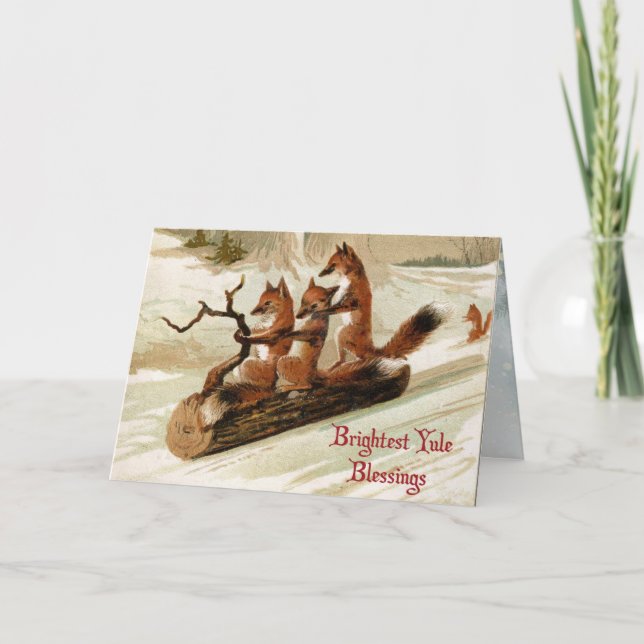 Blessed Yule Sledding Foxes Folded Holiday Card (Front)