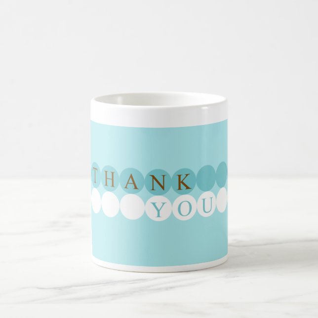 Bleu et blanc entoure la tasse de Merci (Centre)