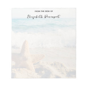 Bloc-note Starfish sur une plage de sable Photo