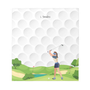 Bloc-note Une golfeuse joue sur le parcours