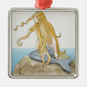 Blonde mermaid sitting on sea rock, side view. metal ornament