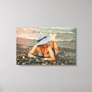 Blonde woman at the beach canvas print
