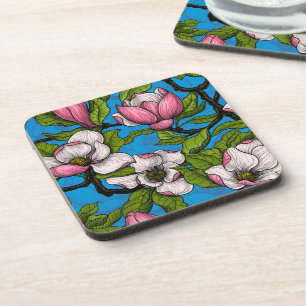 Blooming magnolia on blue coaster