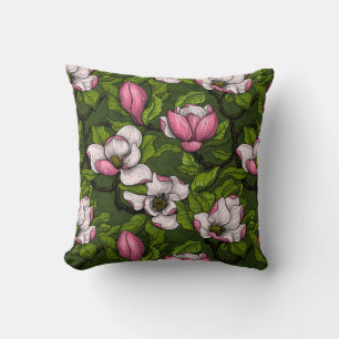 Blooming magnolia on dark green throw pillow