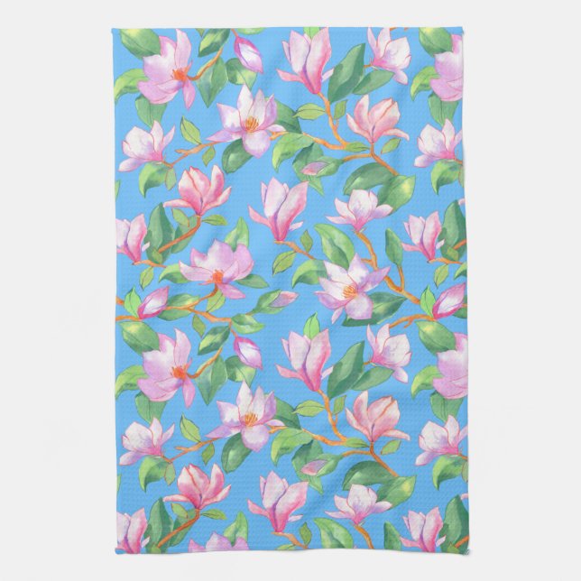 Blooming magnolia on sky blue kitchen towel (Vertical)
