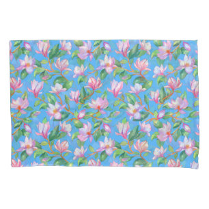 Blooming magnolia on sky blue pillowcase