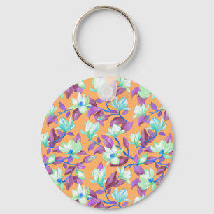 Blooming magnolia on vanilla sky keychain