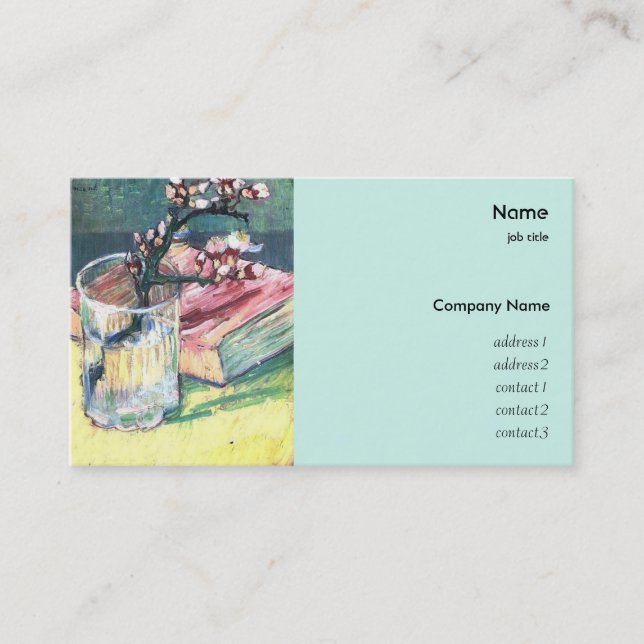 Blossoming almond branch in a glass with a book business card (Front)