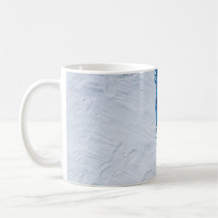 Blue and black floral scarf on white sand coffee mug