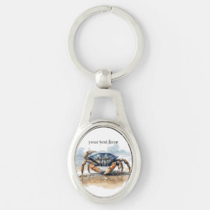 blue and orange crab walking on the beach  keychain