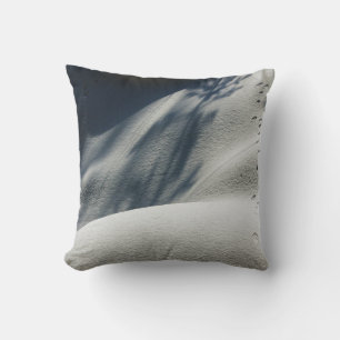 Blue and white floral textile throw pillow