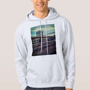 Blue and white train , in front of building hoodie