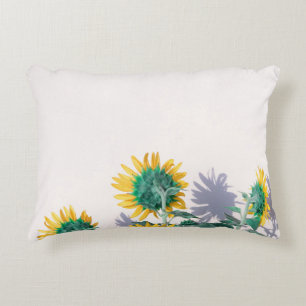 Blue and yellow flowers on white wall accent pillow