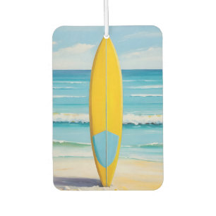 Blue and yellow surf board on the beach air freshener