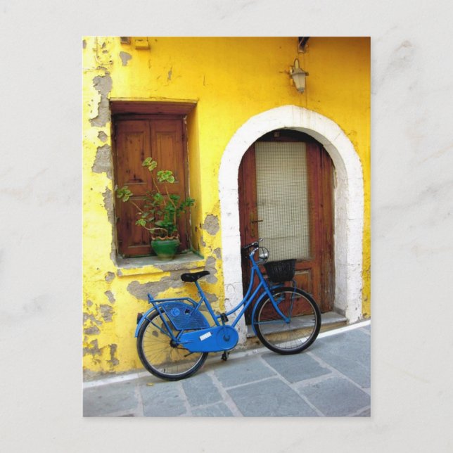 Blue bicycle against a yellow wall postcard (Front)